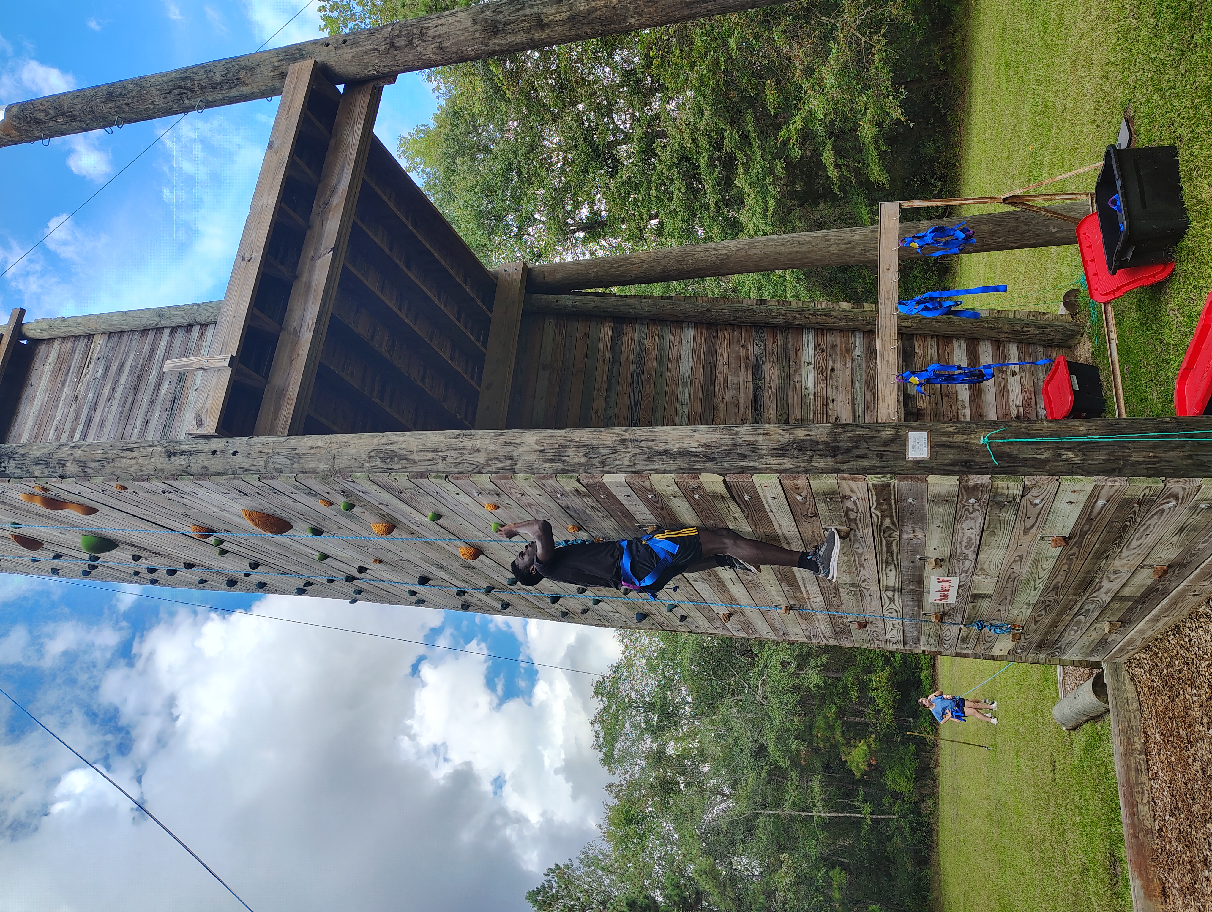 Student climbing at Augusta Cru Fall Retreat